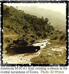 Image of an American M 60 A1 tank crossing a stream in the central mountains of Korea.