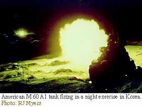 Image of an American M 60 A1 tank firing in a night exercise in Korea.
