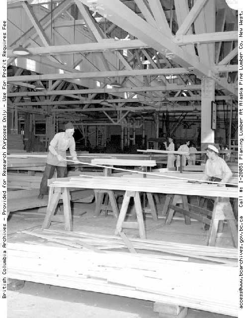 Image of men working in a lumber yard.
