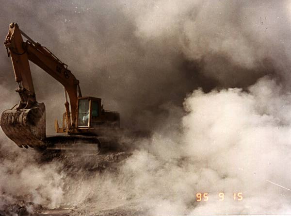 Image of a bulldozer digging in the dirt.