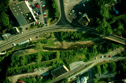 Image showing an aerial view of a third-order stream entering a fourth-order stream.
