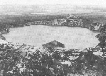 Crater Lake, Oregon; Wizard Island, a cinder cone, rises above the lake surface.