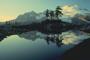 Image of mountains, trees, and a lake.