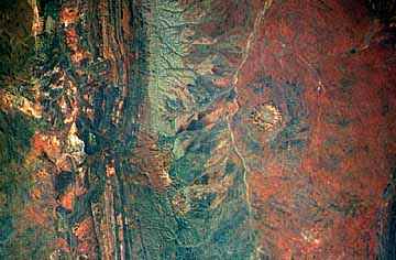 Image of an old section of the MacDonnell mountain range in central Australia.  This image links to another image. 