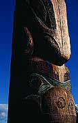 Image of a totem pole figure carved from cedar.