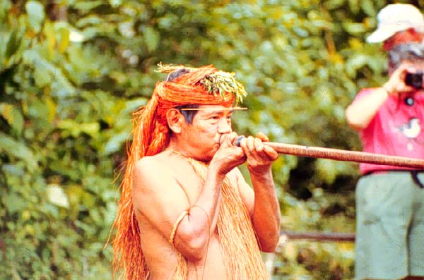 Image of a Yagua tribesman using a blowgun.