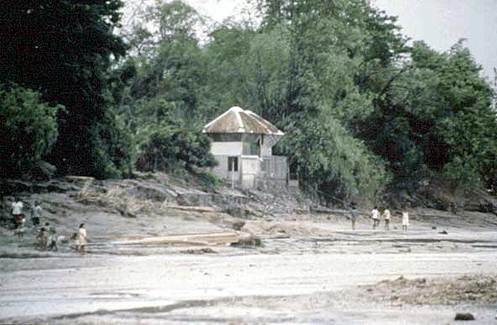 Image showing a house in the Philippines before a mudflow from Mt. Pinatubo.