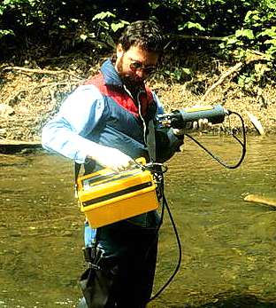 Image of Kenneth E. Rastall using a water quality meter.