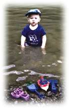 Image of some children playing in Big Wheeling Creek.  This image links to a more detailed image.