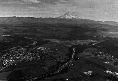 Image of an upstream (southeast) view of the Puyallup River valley about 50 km downstream of Mount Rainier. 